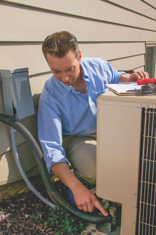 Man Working On Ac Unit Man Working On Ac Unit
